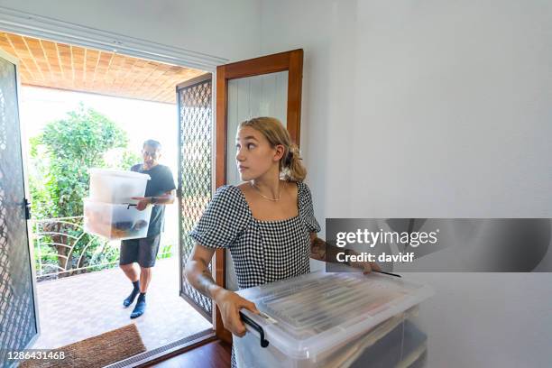 father and daughter moving packing boxes - apartments australia stock pictures, royalty-free photos & images