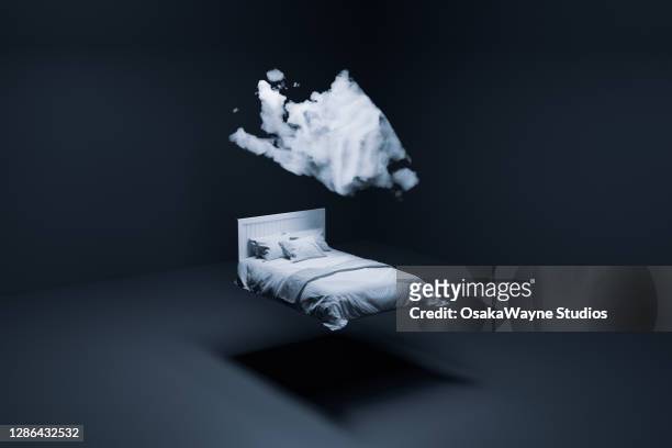 floating bed and cloud - man sleeping pillow stock-fotos und bilder
