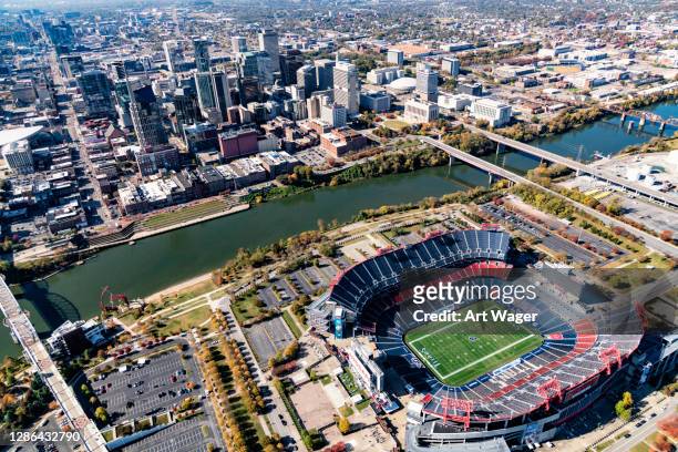 nissan stadium and nashville's skyline beyond - nissan stadion stock pictures, royalty-free photos & images