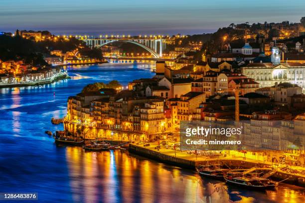 porto old city with douro river at night - porto district portugal stock pictures, royalty-free photos & images