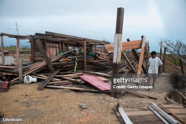 Local villager Ernesto Fonseca checks damages to his property at La Bocanada district after hurricane Iota on November 18, 2020 in Puerto Cabezas,...