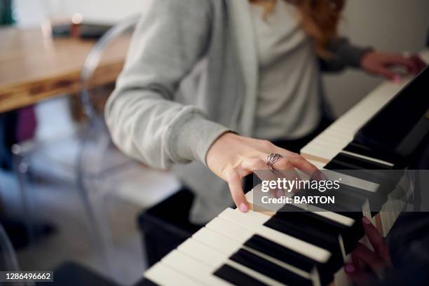 close up of female hands playing piano - practicing piano stock pictures, royalty-free photos & images