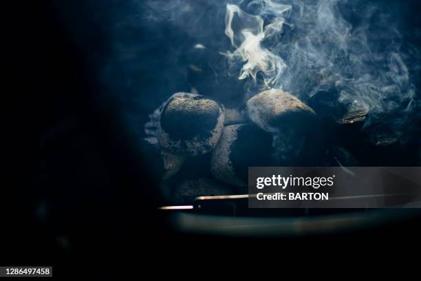 close up of a smoking barbecue - briquettes stock pictures, royalty-free photos & images