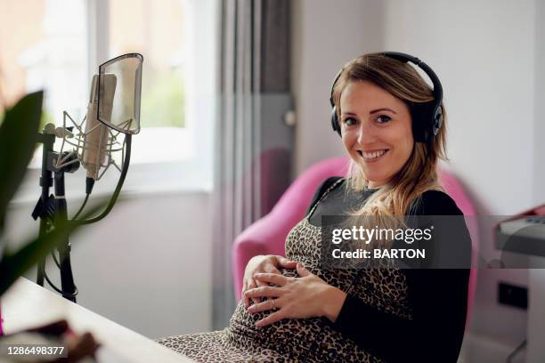 portrait of pregnant singer working from home - reportage home stock pictures, royalty-free photos & images