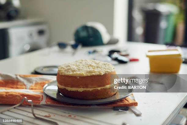 home made sponge cake in kitchen - messy cake stock pictures, royalty-free photos & images