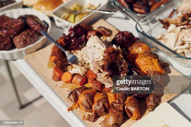 summer barbecue buffet on table - roast chicken table stock pictures, royalty-free photos & images