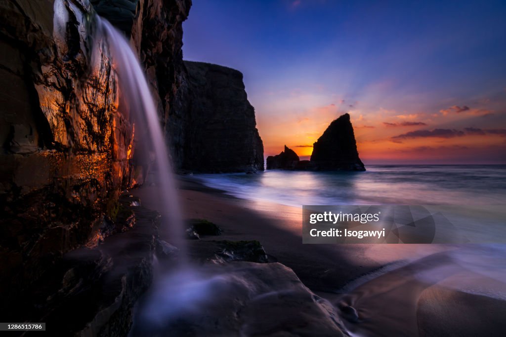 Dawn Over Coastal Waterfalls