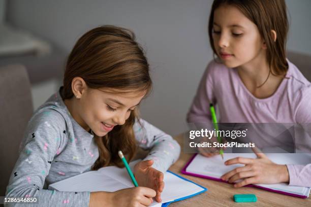 Twins Doing Math Twin Sisters Studying Together Photos and Premium High Res Pictures ...