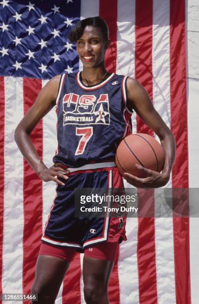 Lisa Leslie, Center for the United States women's basketball team poses in front of the Stars and Stripes national flag of the United States of...