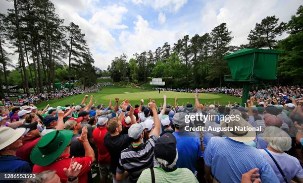 Patrons react to Justin Thomas's birdie on No. 6 during the second round of the Masters at Augusta National Golf Club, Friday, April 12, 2019.