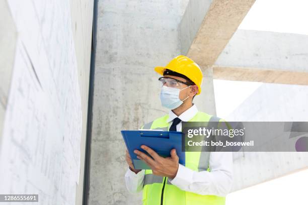 construction manager at work site - infectious disease control stock pictures, royalty-free photos & images