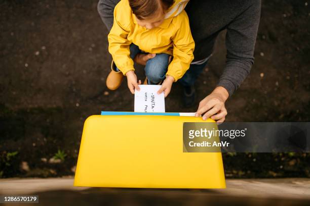 kid sending a letter to santa claus - message sent stock pictures, royalty-free photos & images