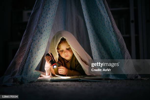 Kid Using Flashlight Photos and Premium High Res Pictures - Getty Images