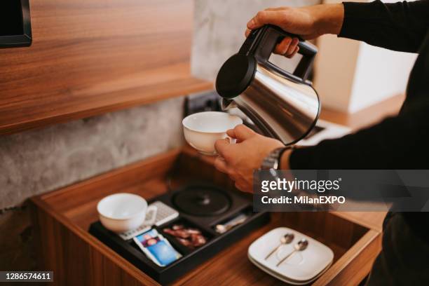 making tea at the hotel - kettle steam stock pictures, royalty-free photos & images