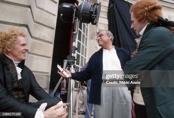 Producer Ismail Merchant jokes with actors NIck Nolte and Lambert Wilson, during the filming of Jefferson in Paris in Versailles, France, in May 1994.