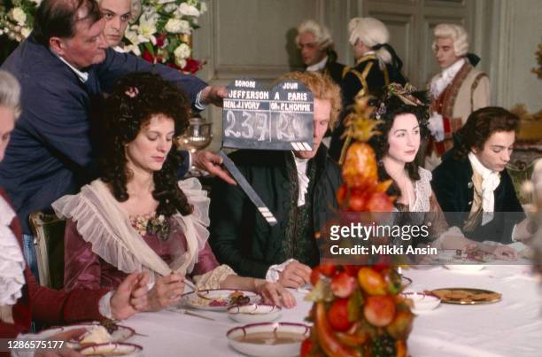 Camera crew member holds the clapboard in front of actor Nick Nolte. Filming is about to begin on the dinner table scene in 'Jefferson in Paris' in...
