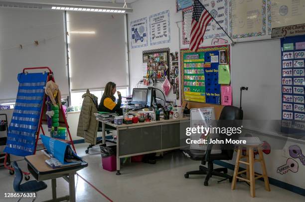 First grade teacher Kristi Munrow speaks to students via Google Meet at Rogers International School on November 19, 2020 in Stamford, Connecticut....