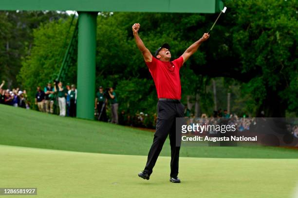 Masters champion Tiger Woods celebrate safter Tiger made his putt on hole No. 18 to win the Masters during the final round of the Masters at Augusta...
