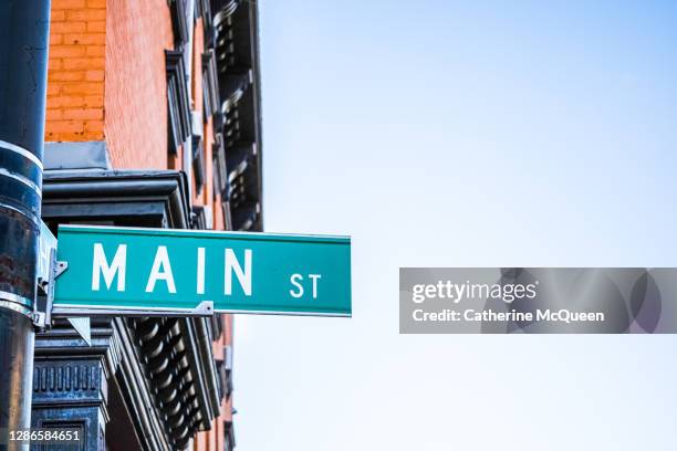 main street usa street sign - small town stockfoto's en -beelden