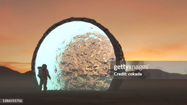astronaut entering portal transportation - time machine stock pictures, royalty-free photos & images