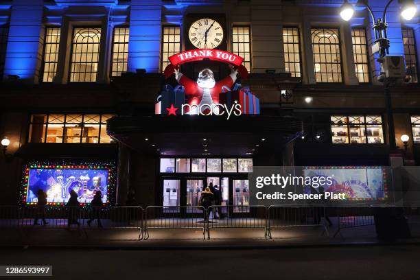 People look at the newly revealed Macy's Herald Square holiday windows on November 19, 2020 in New York City. This year's windows look to give thanks...