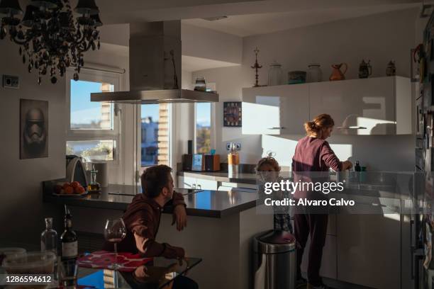 Pablo Sánchez-Rubio and his wife Marta Polo both of whom are health workers at San Jorge Hospital in Huesca, speak with their son Juan in their...