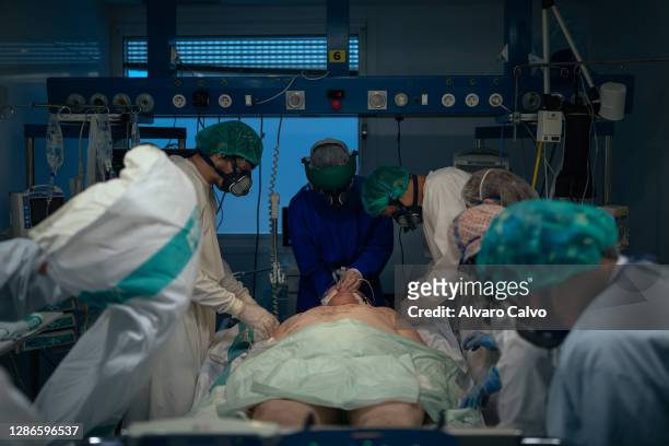 Group of health workers attend to a man infected with Covid-19 in the ICU of the San Jorge Hospital on November 19, 2020 in Huesca, Spain. Marta Polo...