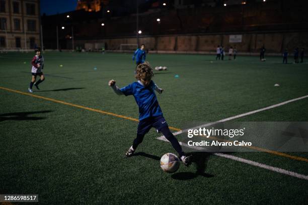 Juan, a son of two health workers from the San Jorge hospital in Huesca, in his football classes in a sports park on November 19, 2020 in Huesca,...