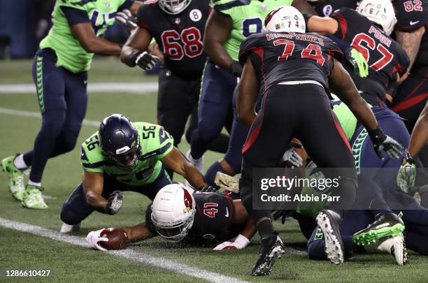 Kenyan Drake of the Arizona Cardinals dives in for a touchdown against the Seattle Seahawks at Lumen Field on November 19, 2020 in Seattle,...