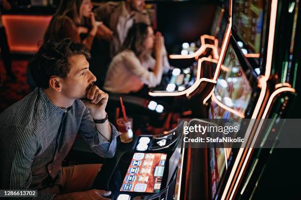 friends gambling in casino - free bet slots no deposit【th733com】triple lucky slot machine stock pictures, royalty-free photos & images