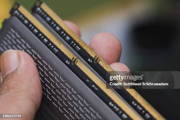 cropped hand holding ddr ram memory - ram stock pictures, royalty-free photos & images