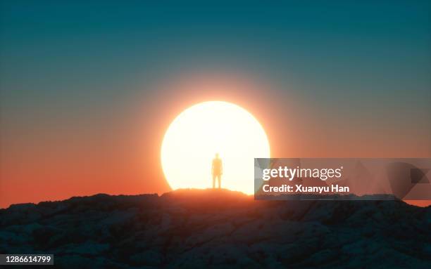 men watching sunrise - horizont über land stock-fotos und bilder