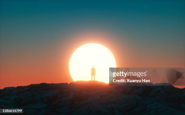 men watching sunrise - sunrise horizon stock pictures, royalty-free photos & images