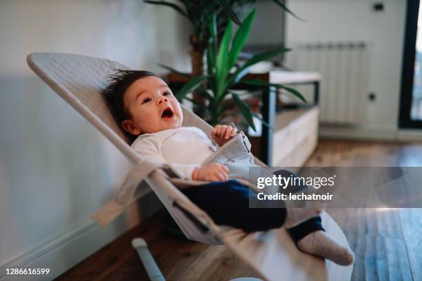 Kid Rocking In Chair Baby Rocking Chair Photos and Premium High Res Pictures - Getty Images