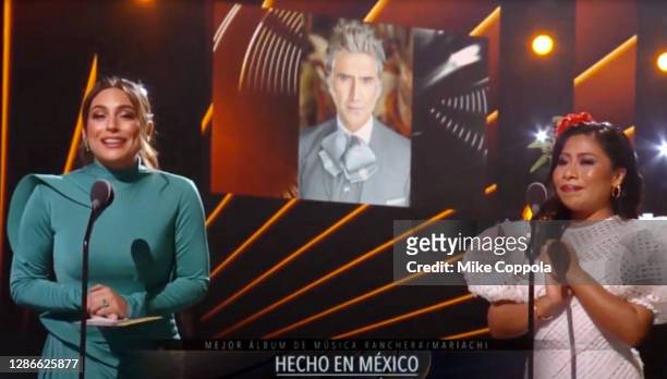 In this screengrab, co-hosts Ana Brenda Contreras and Yalitza Aparicio announce that Alejandro Fernández wins Best Mariachi/Ranchero Album award for...