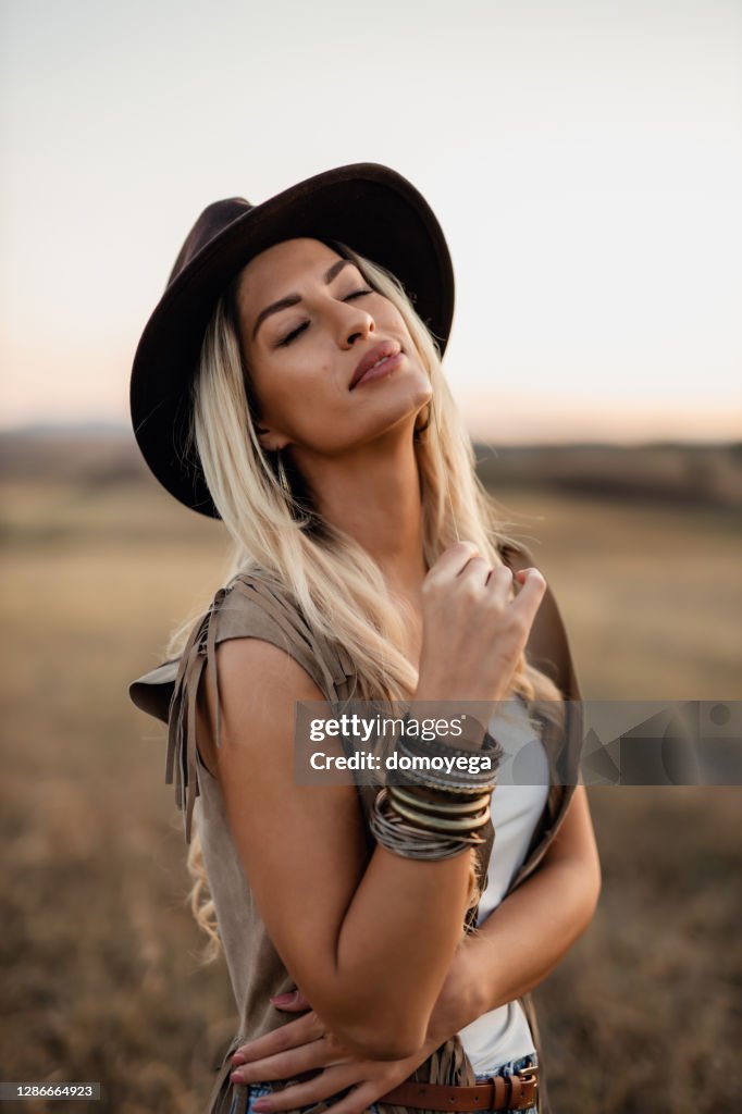 Beautiful Bohemian Styled Woman On A Sunny Day In Nature High-Res