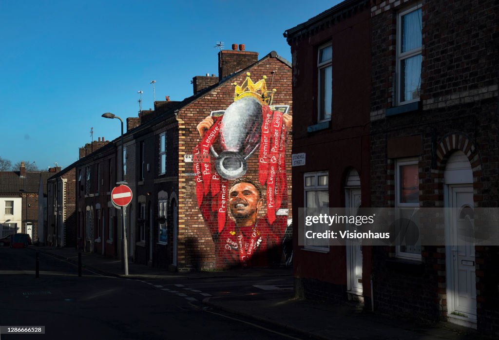 A Mural of Liverpool Captain Jordan Henderson Lifting the Premier League Trophy
