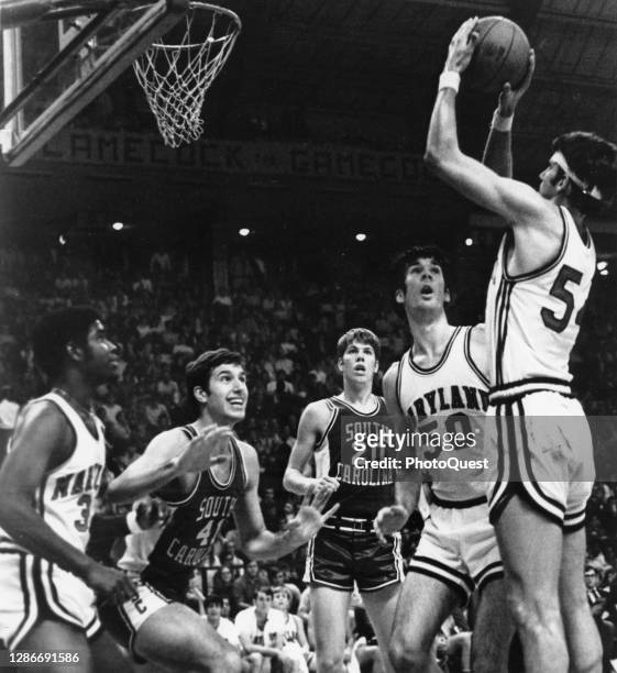 An unidentified basketball player from the Universities of Maryland Terrapins takes a jump shot during a game against the University of South...