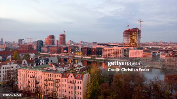 In this aerial view the new building area next to East Side Gallery , a section of the former Berlin Wall that is covered in street art, stands...