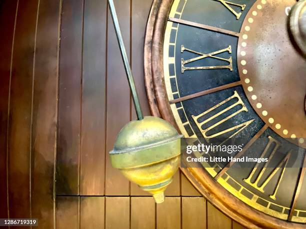 clock pendulum - pendel stock-fotos und bilder