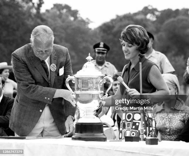 Susie Berning of the United States gets ready to talk to the crowd after winning the 1972 U.S. Women's Open Golf Championship Trophy on July 2, 1972...