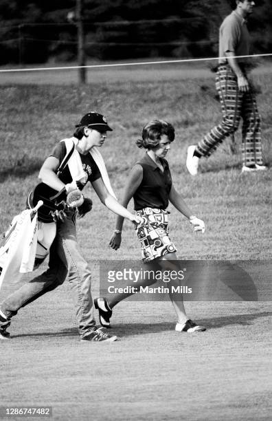 Susie Berning of the United States walks with her caddie during the 1972 U.S. Women's Open Golf Championship on July 2, 1972 at the Winged Foot Golf...