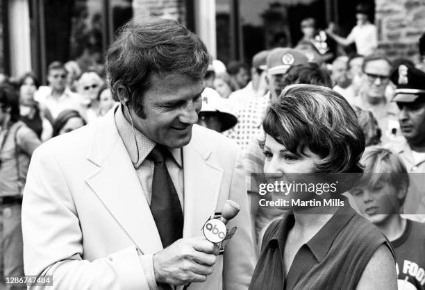 American football player, actor, and ABC television sports commentator Frank Gifford interviews Susie Berning of the United States after she won the...