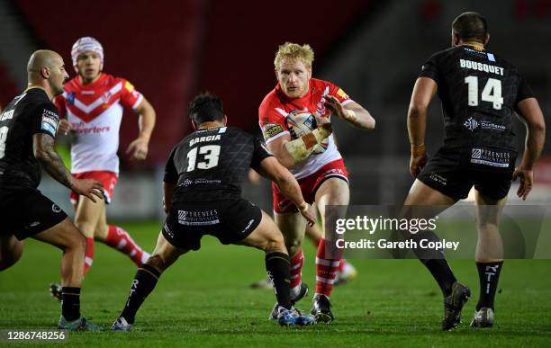 James Graham of St Helens takes on Ben Garcia of Catalans during the Betfred Super League Play-Off Semi-Final between St Helens and Catalans Dragons...