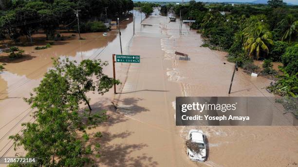 Aerial view of a section of the San Pedro Sula-Progreso Yoro highway flooded due to the rain caused by tropical storm Iota on November 20, 2020 in...