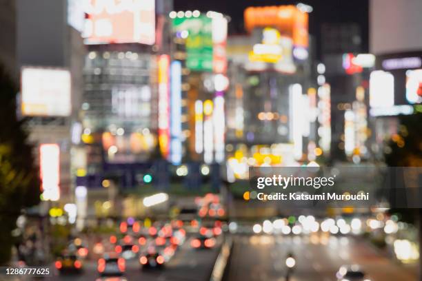 blurred abstract urban scene background - red light district 個照片及圖片檔