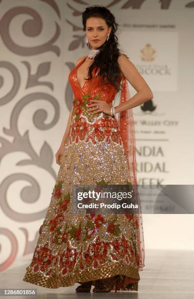 Neha Dhupia walks the ramp for designer Falguni and Shane Peacock at the Aamby Valley Indian Bridal week on October 31, 2010 in Mumbai, India