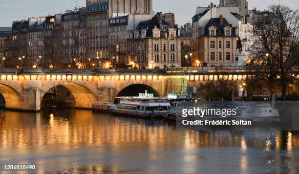 The Pont neuf, the "Ile de la Cité" and the banks of the Seine in Paris on November 18, 2020 in Paris, France.