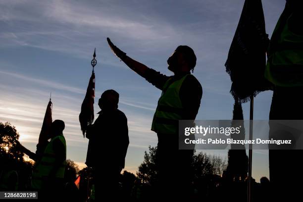 Far right wing supporters do the fascist salute at the end of the 50 kilometers long walk 'Crown March' outside the Valley of the Fallen to...