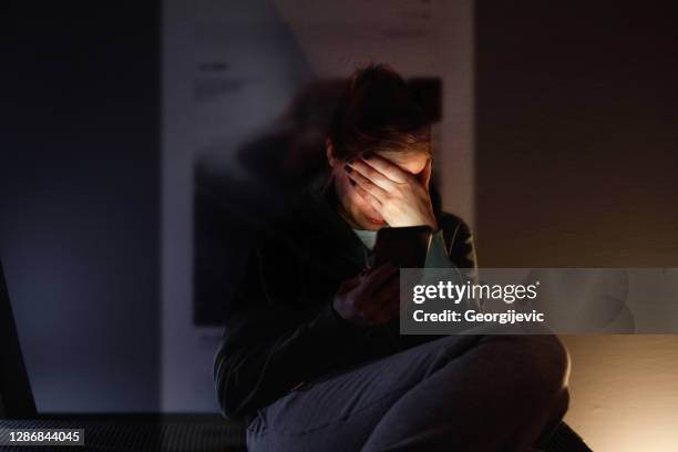 the social media addiction - crying phone call stock pictures, royalty-free photos & images